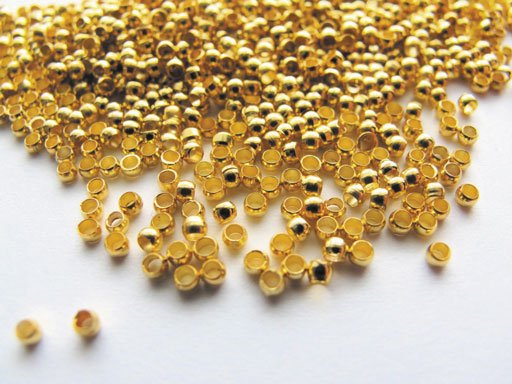 Paket med 60 guldfärgade klämpärlor 2 mm Paket med 60 guldfärgade klämpärlor 2 mm